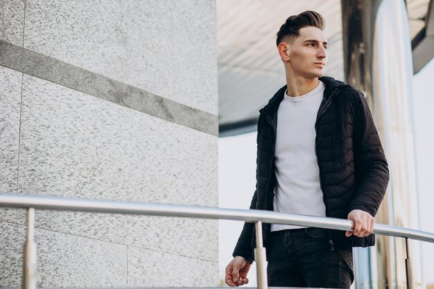 Young handsome man standing in the street