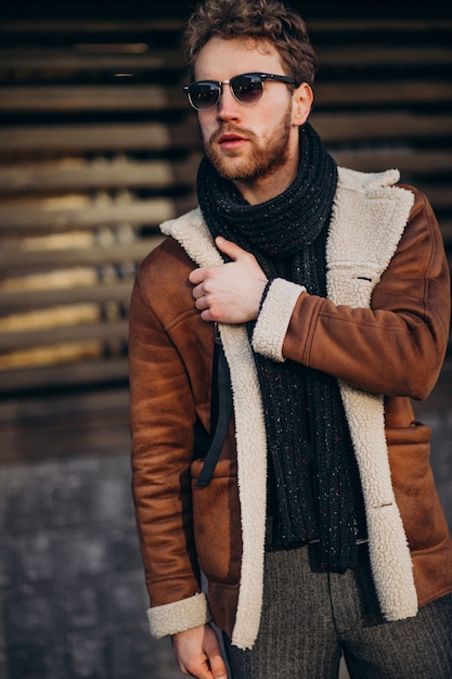 Young handsome man in a street outfit