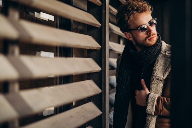 Free photo young handsome man in a street outfit