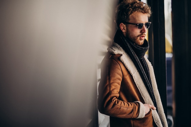 Free photo young handsome man in a street outfit