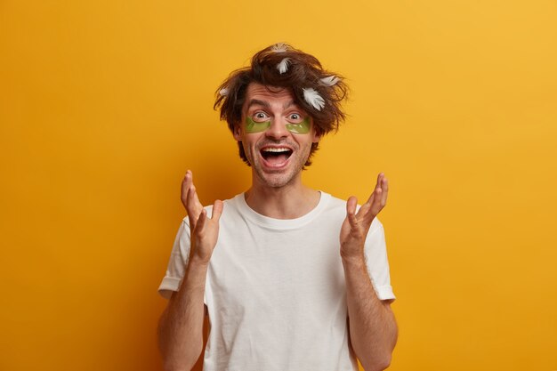 Young handsome man student with trendy hairstyle isolated