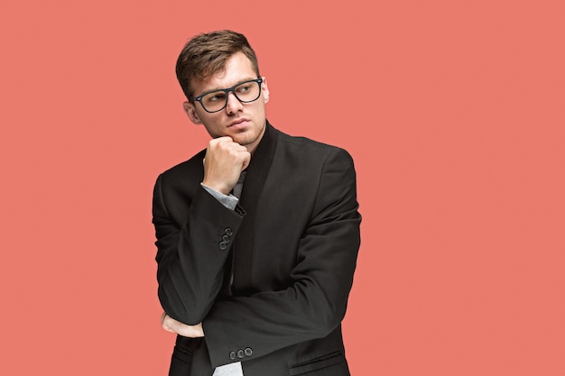 Young handsome man in suit and glasses