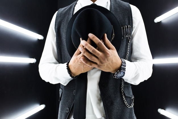 Young handsome smiling hipster black man in retro vintage style suit dancing hip hop in disco night club, having fun