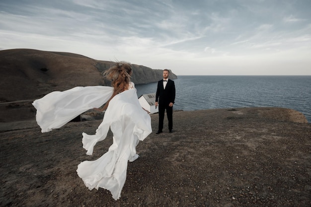 Young happy bride in wedding dress and groom