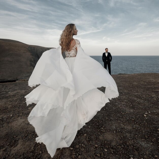 Young happy bride in wedding dress and groom