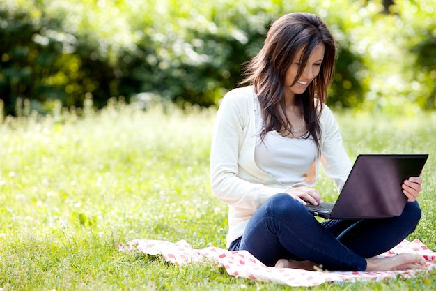 Free Photo young and happy girl with laptop