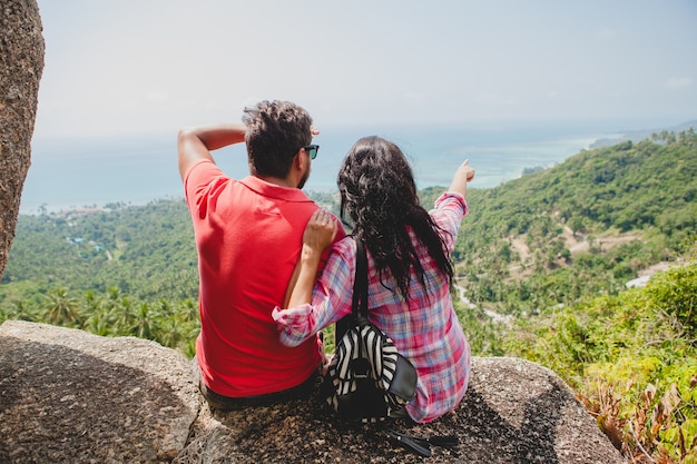 Young happy hipster couple in love traveling around world