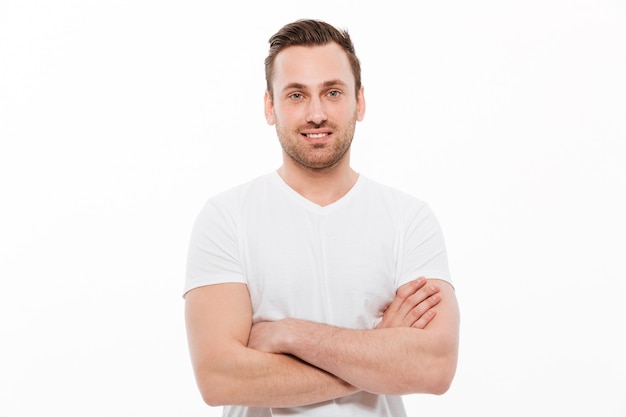 Young happy man standing isolated