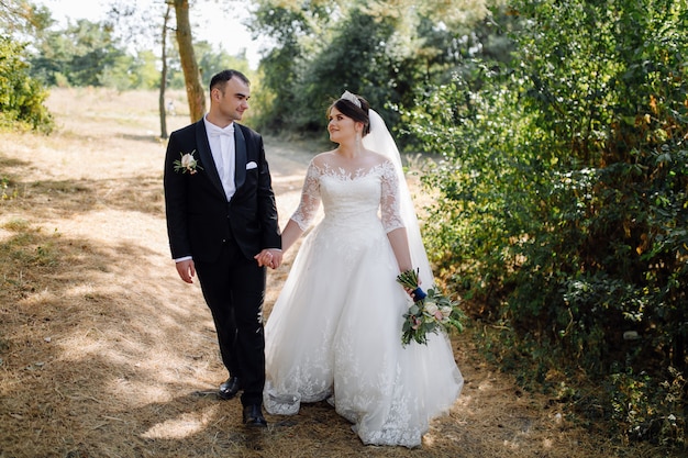 Young Happy wedding couple. Caucasian bride and groom embracing