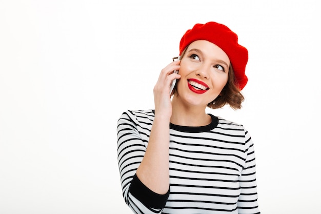 Young happy woman talking by mobile phone