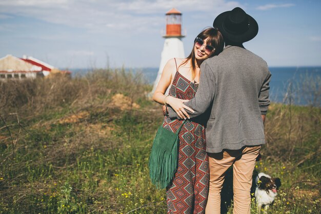 Young hipster couple posing in the countryside