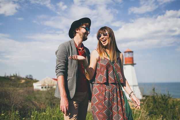 Young hipster couple posing in the countryside