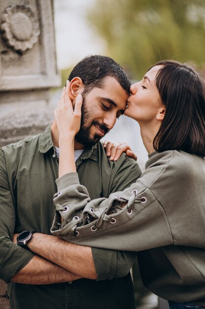 Young international couple together in park