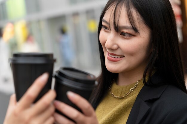 Young japanese influencer recording vlog