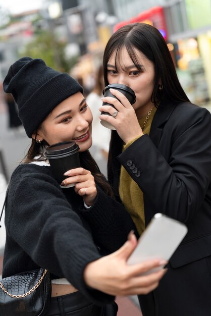 Young japanese influencer recording vlog