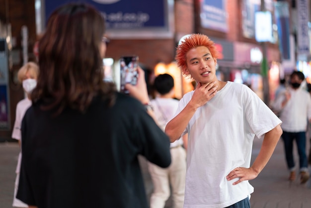 Free photo young japanese men portrait in urban location