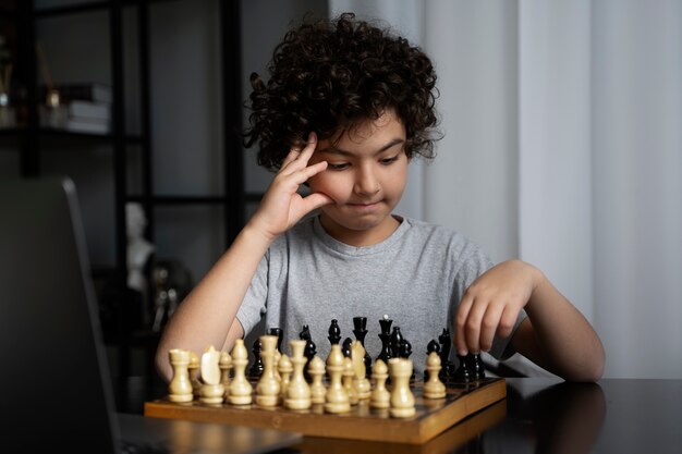 Young kid playing chess