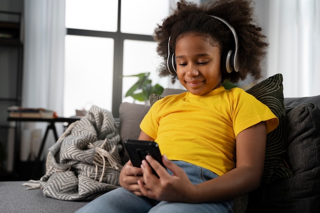 Young kid playing on smartphone