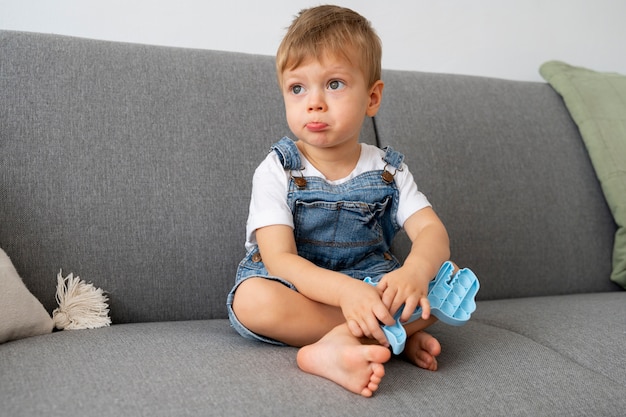 Young kid playing with fidget at home