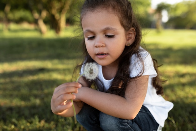 Free Photo young kid spending time in nature