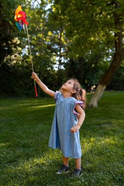 Free photo young kid spending time in nature