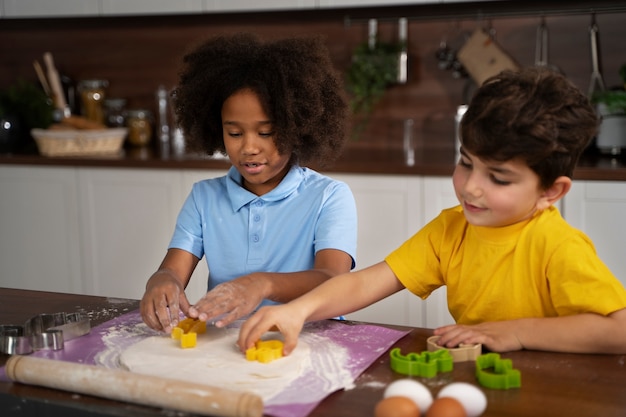 Young kids cooking together