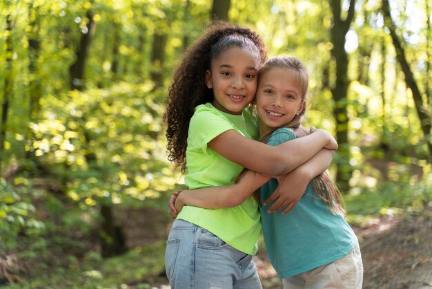 Young kids exploring together the nature