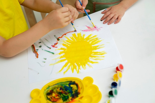 Young kids painting close-up