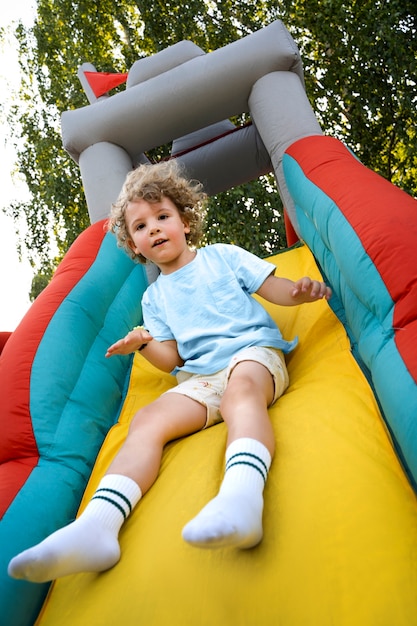 Young kids playing in bounce house