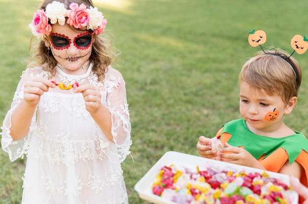 Young kids with costumes in park