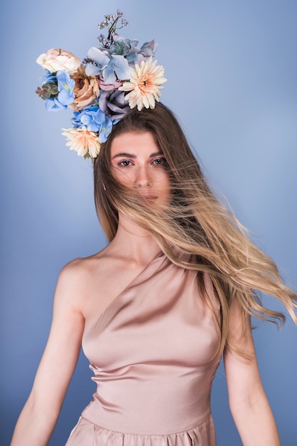 Free photo young lady in evening dress with beautiful flower wreath