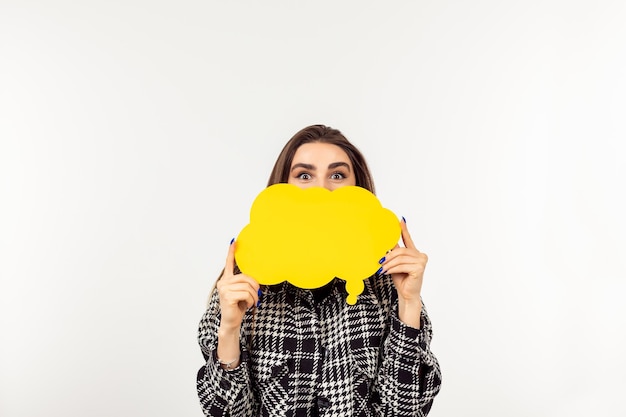 Young lady holding idea cloud and standing white background