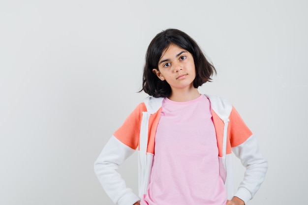 Free photo young lady in jacket, pink shirt and looking serious.