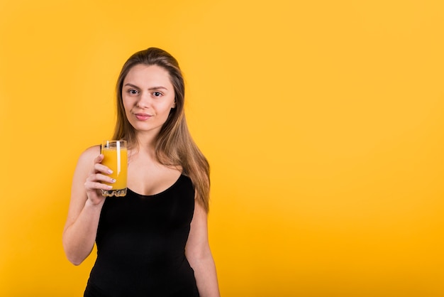 Free photo young lady with glass of juice