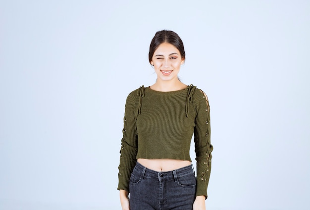 Free photo a young lovely woman model standing on white background