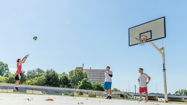 Young male basketball player taking a free throw