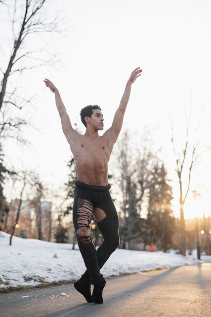 Young male dancer in elegant ballet position