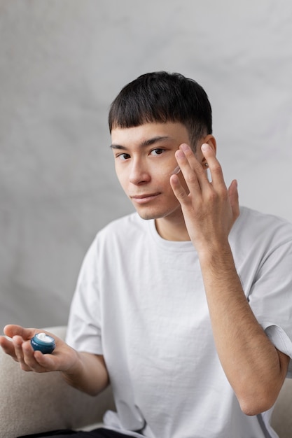 Free Photo young male doing selfcare routine