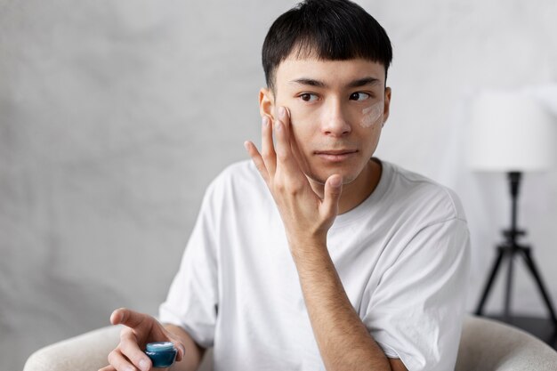 Young male doing selfcare routine