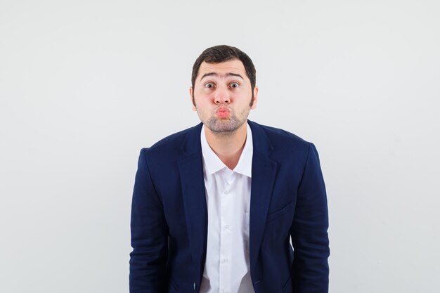 Young male pouting lips in shirt