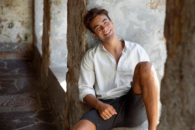 Young male traveler posing and smiling