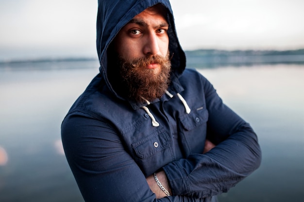 young man beard handsome portrait beach