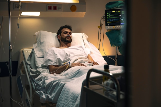 Young man being ill in a hospital bed