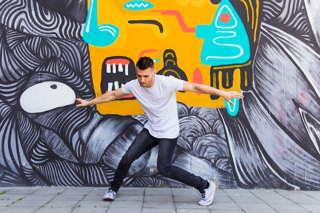 Free Photo young man dancing on street