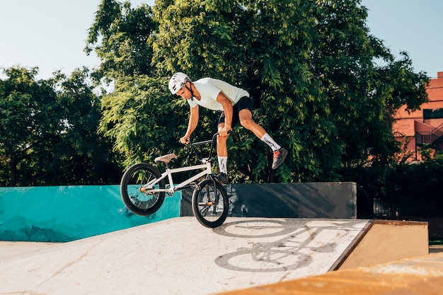 Young man doing tricks with bmx bike