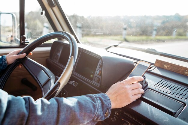 Young man driving a van close-up