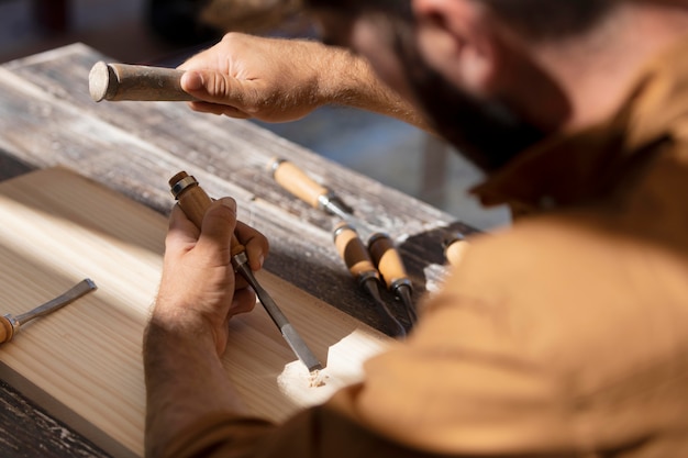 Young man engraving in wood