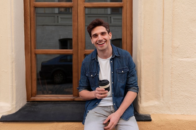 Young man enjoying a cup of coffee