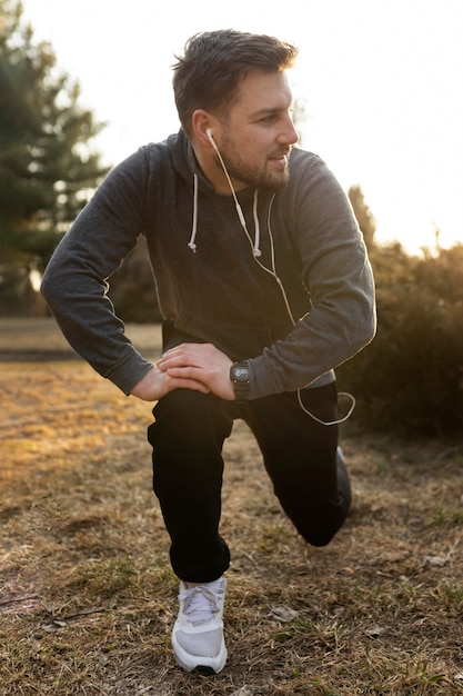 Young man exercising outdoors in the park