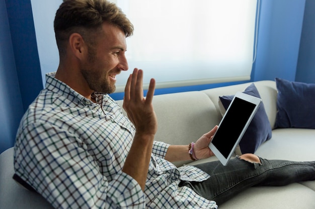 Free photo young man having a videoconference